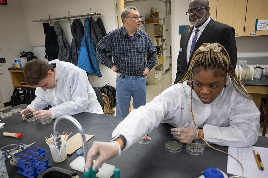 Two students work in a science lab.